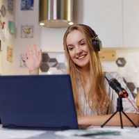 blonde-woman-wearing-headphones-with-microphone-le-2021-11-05-00-08-26-utc.jpg